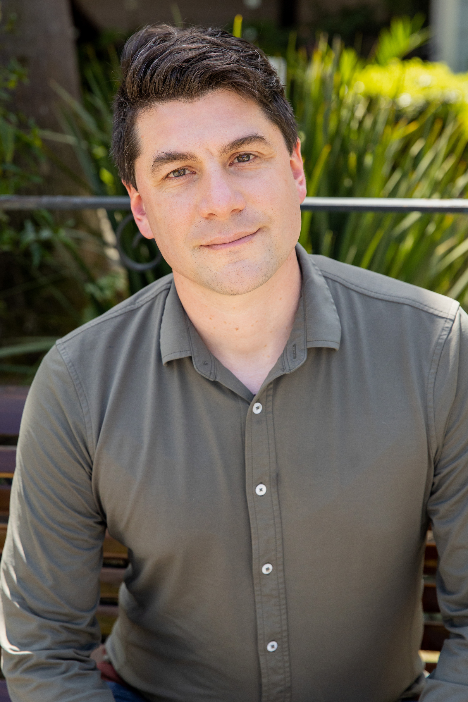 Photo of David Jay smiling.